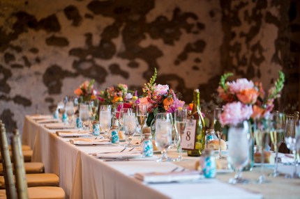 Wedding Flower Arrangements in Mason Jars on Long Tables