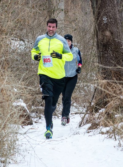 The guy in yellow took the lead through the entire trail section and I stayed tucked in right behind him (as this photo illustrates... you can hardly see me!) Photo Credit: RunningMadPhoto