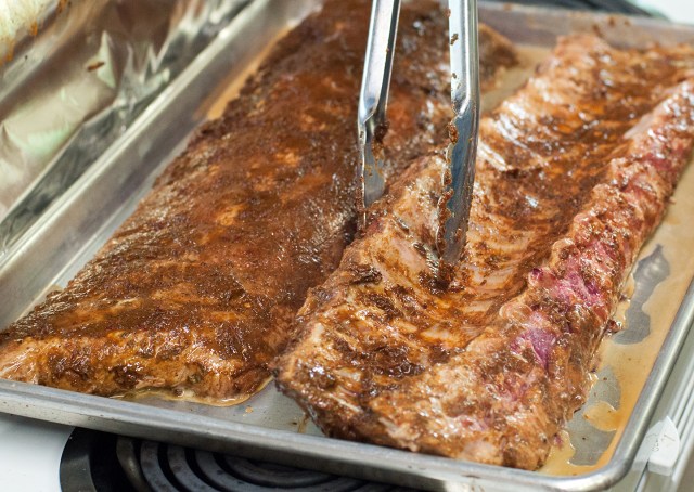 Flipping the ribs during roasting